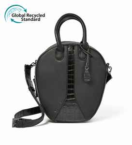 Black vegan leather oval round shoulder handbag with gunmetal hardware photographed against a white background with the Global Recycled Standard logo.