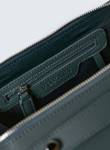 Load image into Gallery viewer, Teal vegan leather crossbody handbag showing recycled blue plastic lining with silver hardware photographed against a white background.
